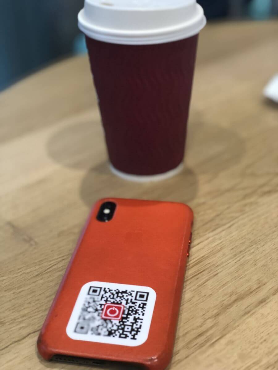 A QR sticker on a phone